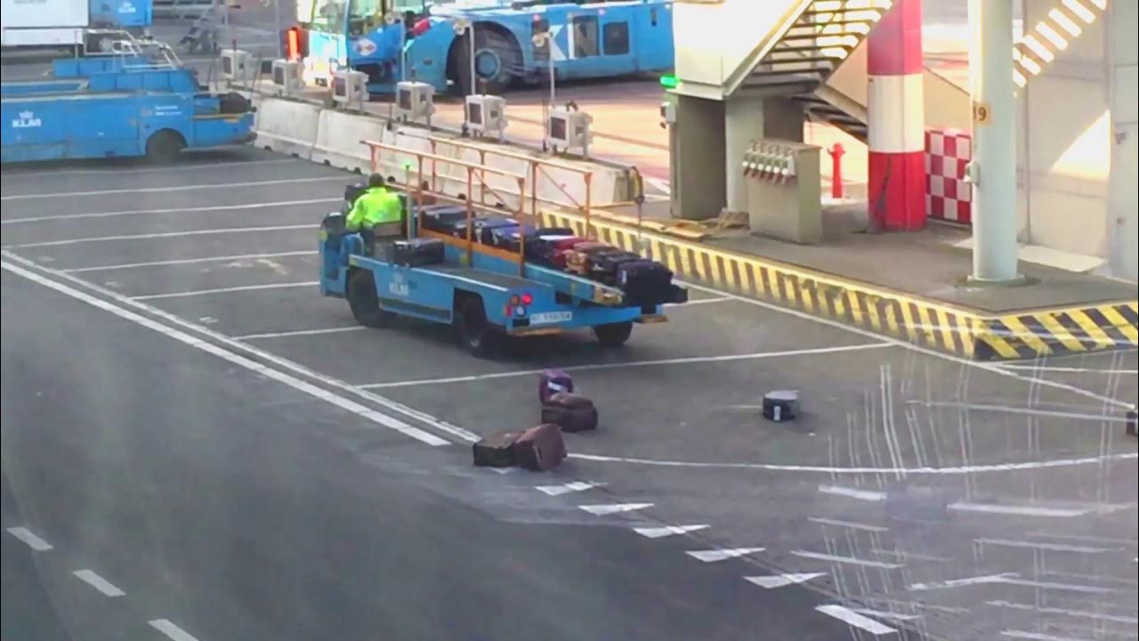 KLM Luggage fate at Amsterdam airport Dropping bags and running over