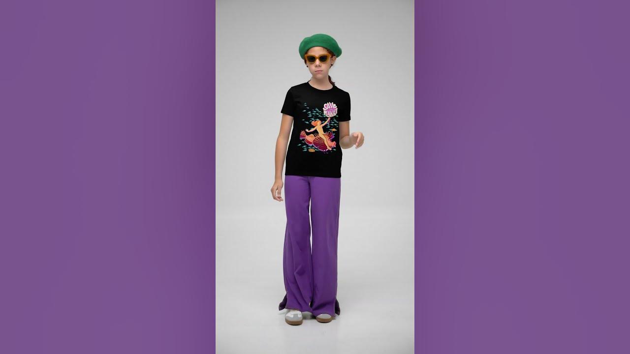 bella canvas t shirt video featuring a girl posing with cool sunglasses in a studio 7899v