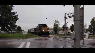 Waterloo Central GMD1 1012 passes Farmers Market station