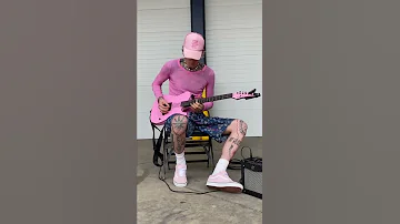 MGK playing his pink guitar 👽