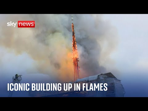 Spire falls after fire breaks out at Copenhagen's Old Stock Exchange building.