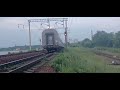 Электровоз ЭП1-317 с фирменным поездом «Океан» следует по Транссибирской магистрали летним вечером.