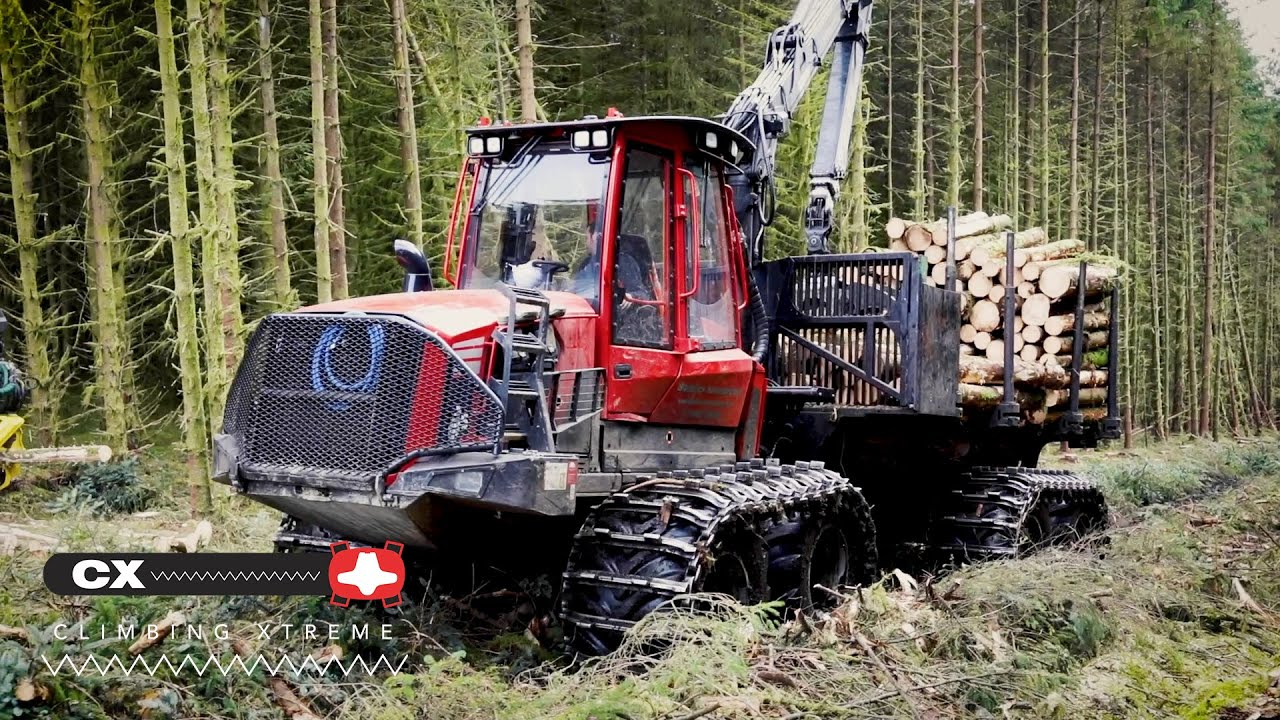 Komatsu 855 forwarder with Clark Tracks CX Climbing Xtreme tracks - YouTube