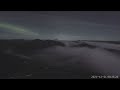 Aurora breaks through the fog