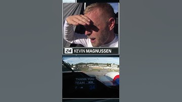 Kevin Magnussen watches his teammate make a pass mid interview!