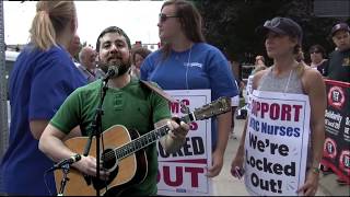 “We’re Organizing for Justice” by Paul McKenna, performed by Ben Grosscup