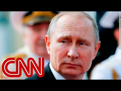 Putin wins 6 more years in power, exit polls show