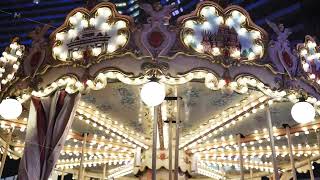 Carousel with glowing lights and Saint Basil's Cathedral artwork at night in Moscow Carousel with glowing lights and Saint Basil's Cathedral artwork at night in Moscow