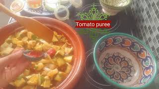 Delicious tagine with shrimp, mussels and eggplant in tomato sauceطاجين لذيذ مع الجمبري وبلح البحر