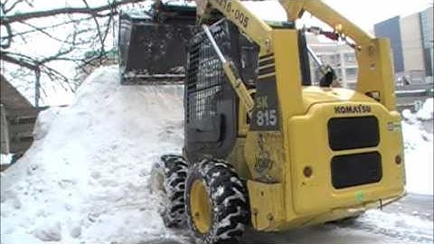 Precision Clearing Snow with Bobcat Skid-Steers