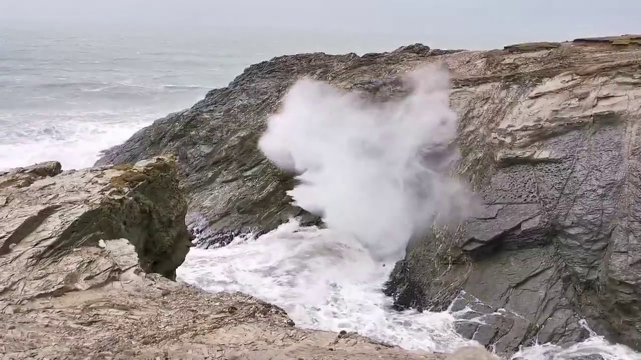 Marine Geyser as wave crashes through the Porth Island blowhole