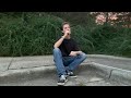 Smoking a Cigarette While Sitting on the Edge of a Sidewalk