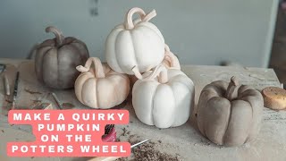 Ceramic pumpkins on the pottery wheel with the thrown and altered technique