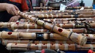 The process of making a traditional Korean bamboo flute that produces a beautiful sound