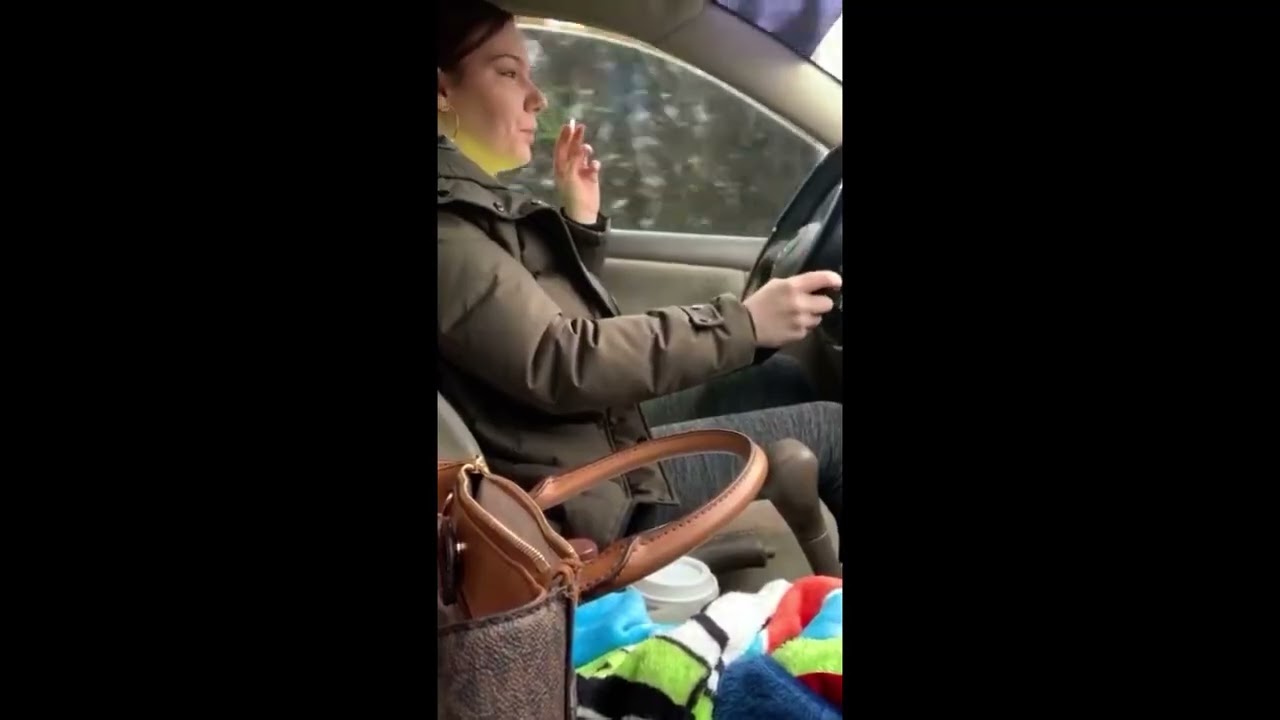 Girl smoking and littering in the car