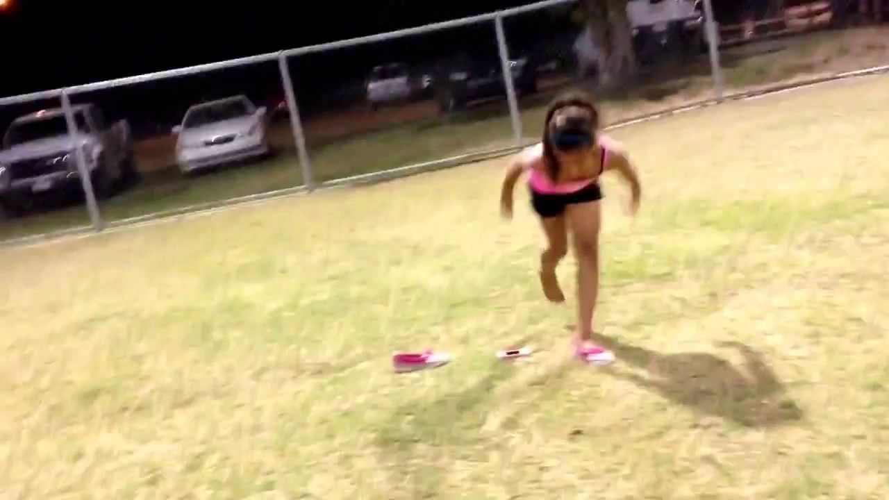 Marisa doing back hand spring at softball game