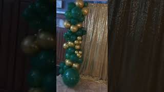 Green and gold backdrop set up