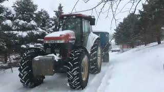 driving tractor in the snow some time ago