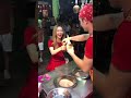 Turkish ice cream vendor shows tricks with stick and cone to customer while serving  1168135