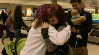 Families reunite for Thanksgiving in Detroit Metro Airport
