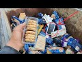 Shocking image: a brand new phone amidst a pile of discarded food.