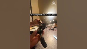 Installing my custom ESP32 flight board into the drone shell.