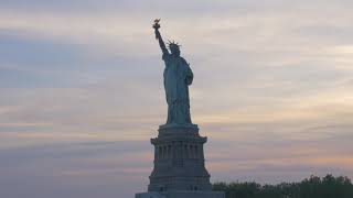 New York's Statue of Liberty as seen from a ferry boat at sunset - Free HD Video