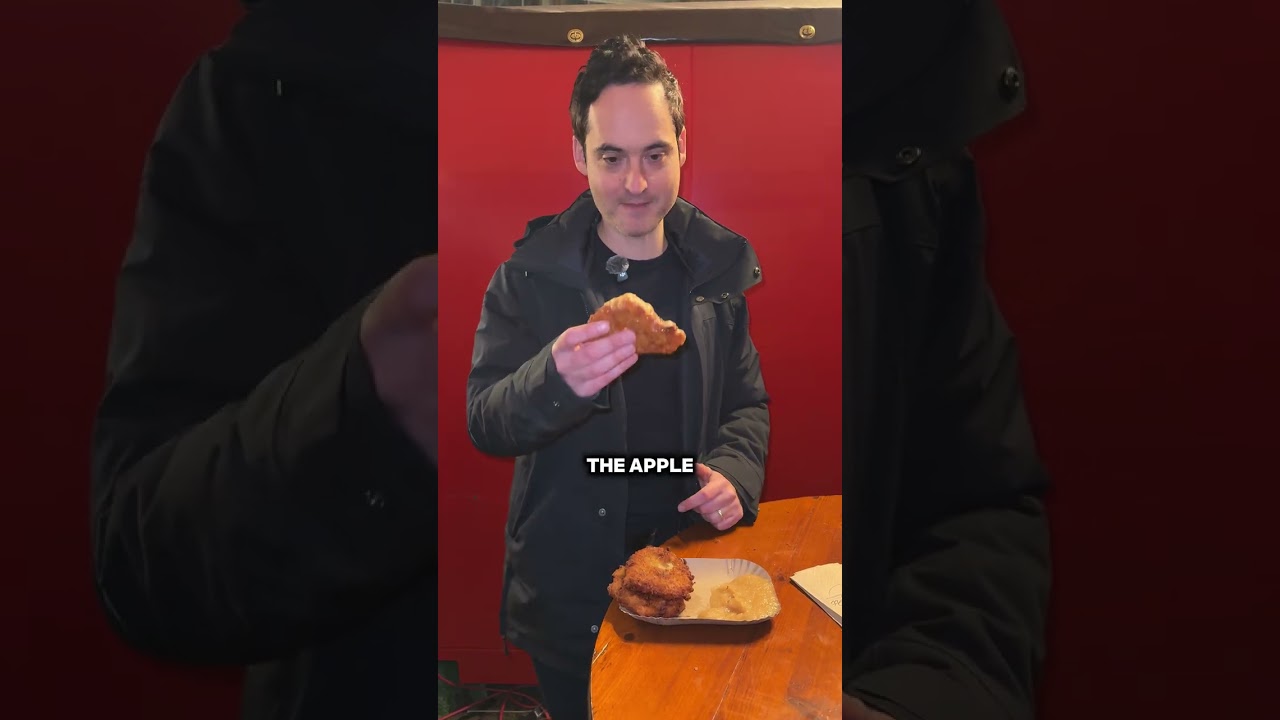 Trying Kartoffelpuffer (potatoe pancakes) at a European Christmas Market (Frankfurt, Germany)