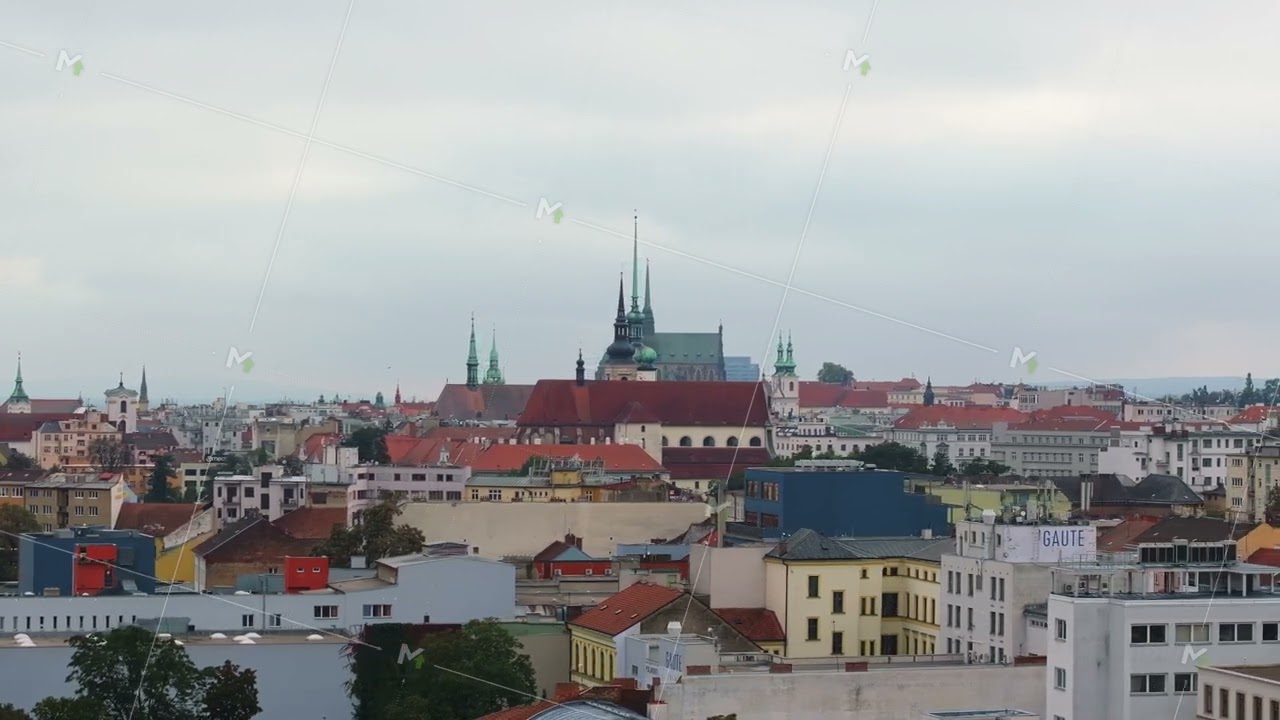 Brno rooftops with Saint Peter and Paul Cathedral in the distance. The camera is panning right