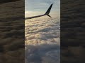 Вид облаков из иллюминатора самолёта