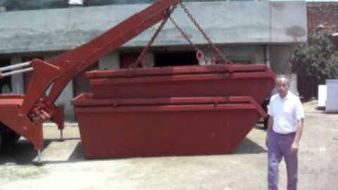 C Loading one skip (stacked) from ground on truck.AVI