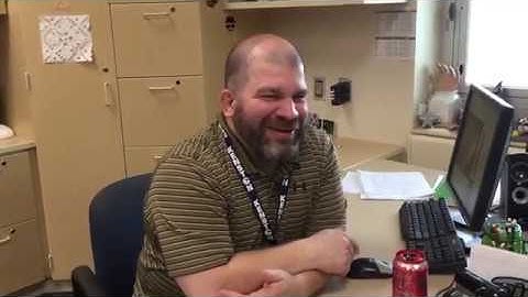 What runs around a yard without moving?