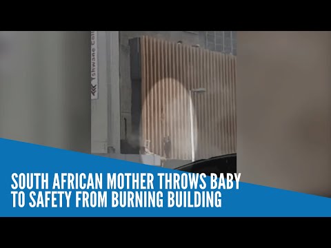 South African mother throws baby to safety from burning building