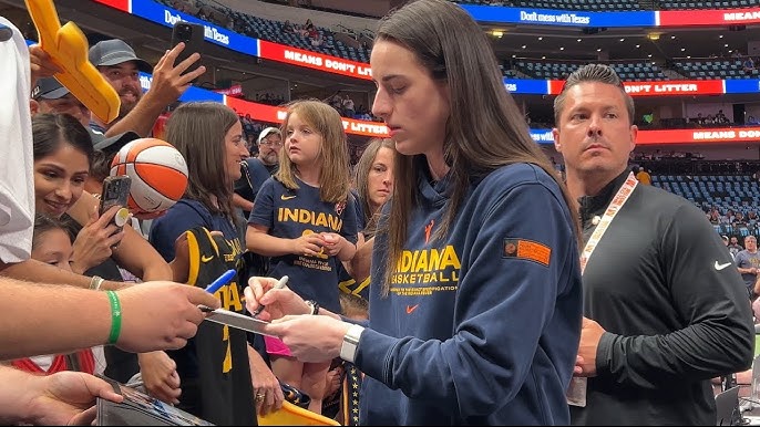 Caitlin Clark signs autographs for fans before WNBA game in Dallas