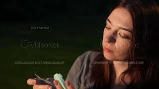 Closeup View Of Young Adult Pretty Woman Wiping Out Face By Napkin Looking At Herself In Hand Mirror