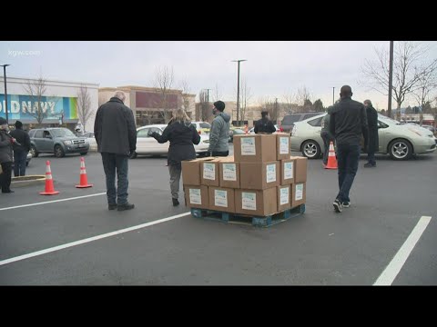 Hundreds of struggling families take home food boxes with help of surprise donation