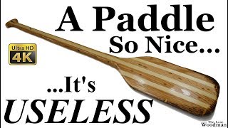 Hand carved paddle made of pallet wood and finished with fiberglass resin. It turned out so nice, it