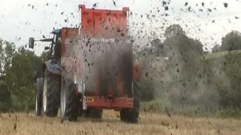 NC 7m3 Manure Spreader with New Holland Tractor.mpg