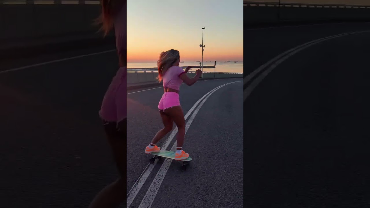Longboard girl with sunrise 