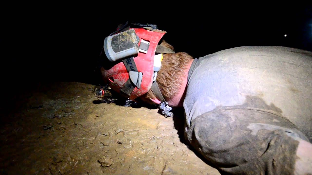 Exausted caver takes a nap inches from a 586' pit!
