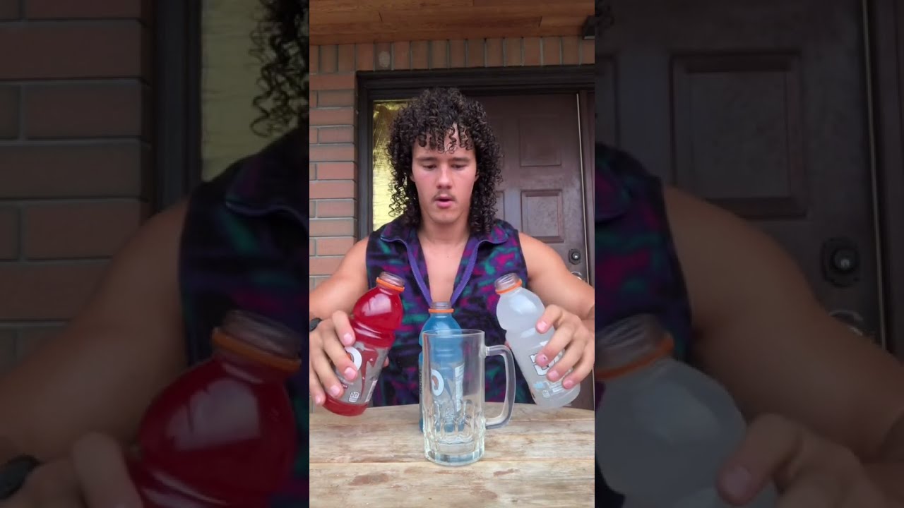 Guy quickly chugs three whole bottles of Gatorade!