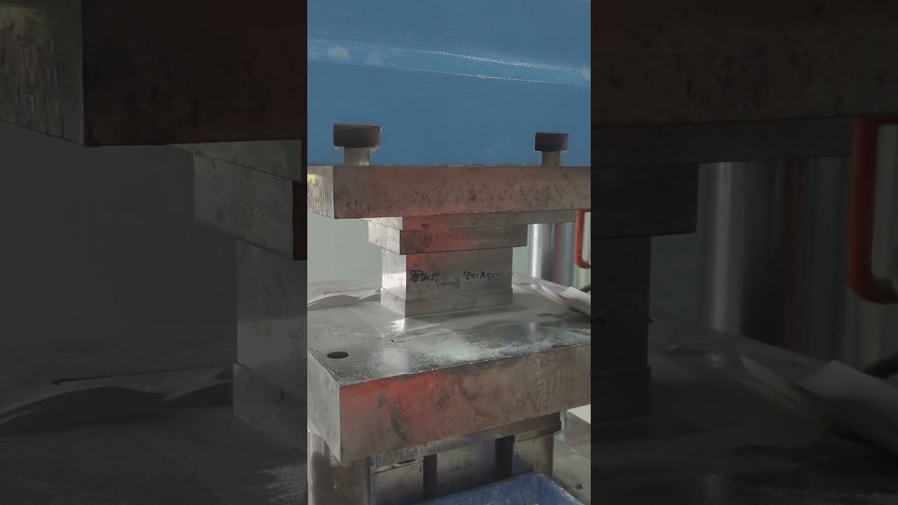 Dry pressing of alumina ceramic plates in advanced ceramic manufacturing. 