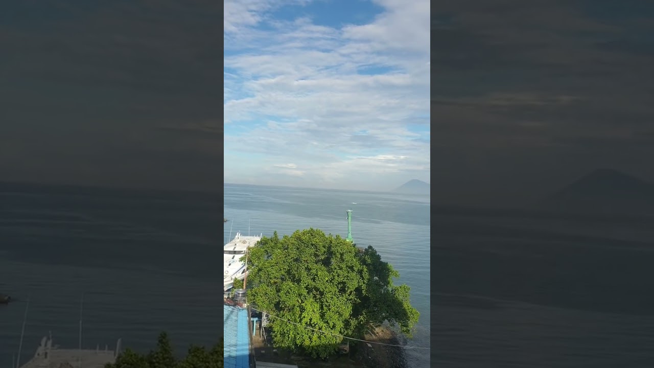 Manadotua island, Bunaken , and Mount Tumpa from Soekarno Bridge