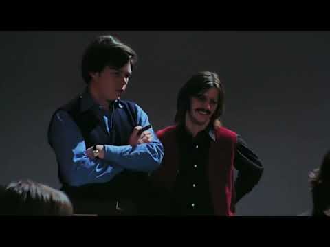 Ringo Starr watching Paul McCartney play the piano