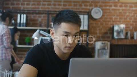 Confident Ethnic Man Using Computer | Stock Footage - Envato elements