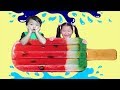 Kids Play with Big Inflatable Ice Cream Popsicle in Pool