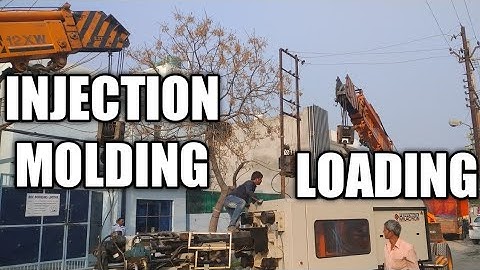 Loading and unloading of injection molding machine
