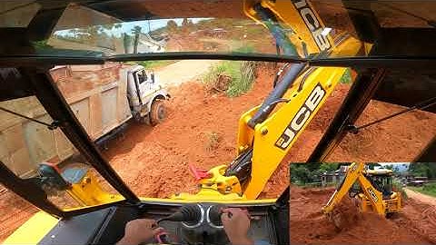 jcb loading soil into a dump truck // jcb loading inside view
