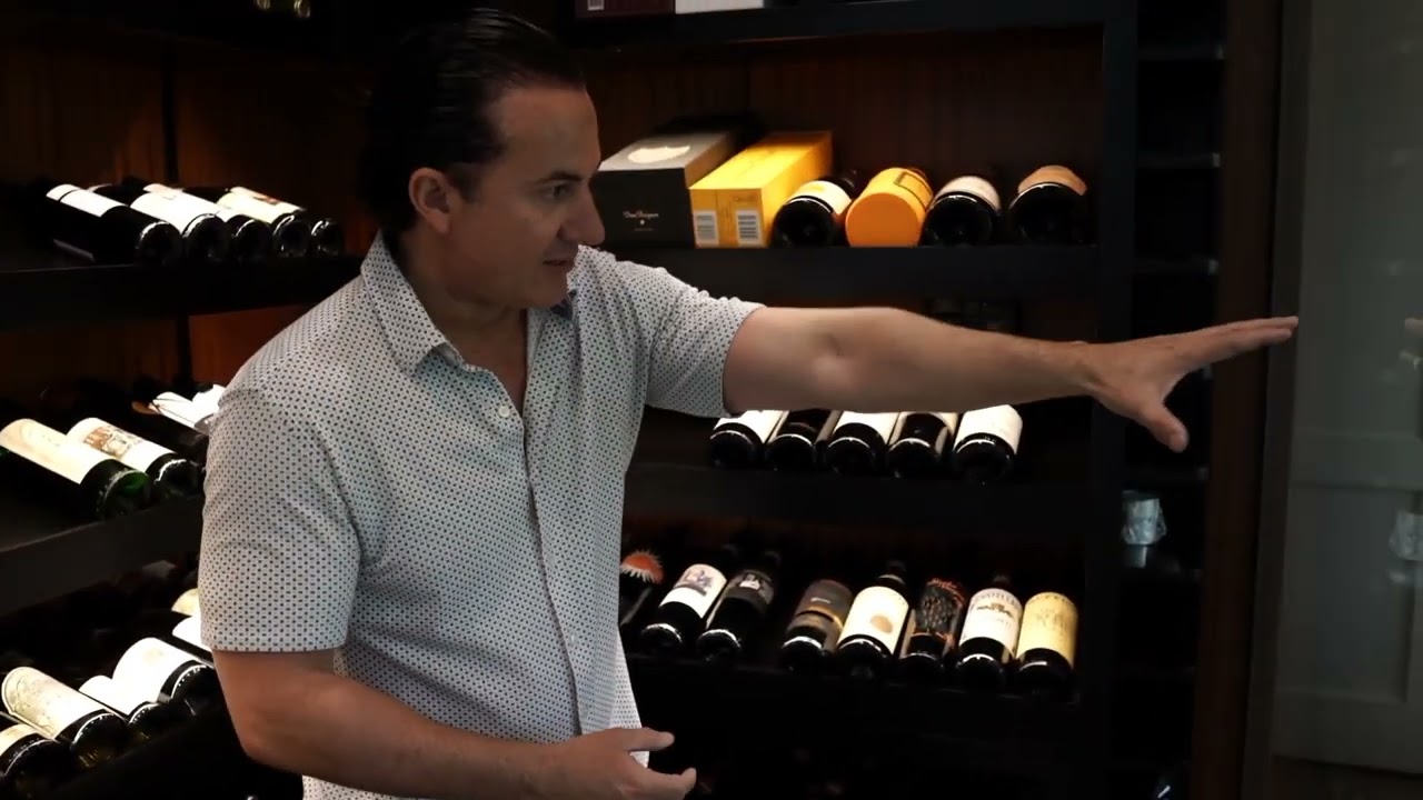 Sleek and Giant Glass Wine Room Stands Out in a San Diego Home