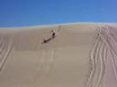 Sandboarding a big dune at stockton